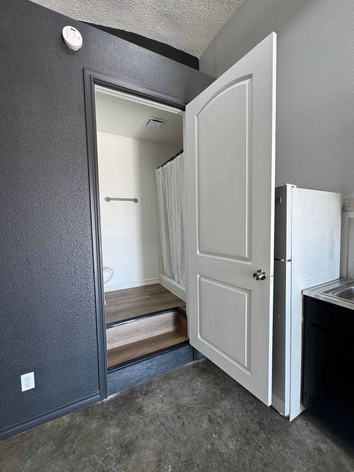 Bathroom entry beside the kitchenette in a dome unit at The Domain