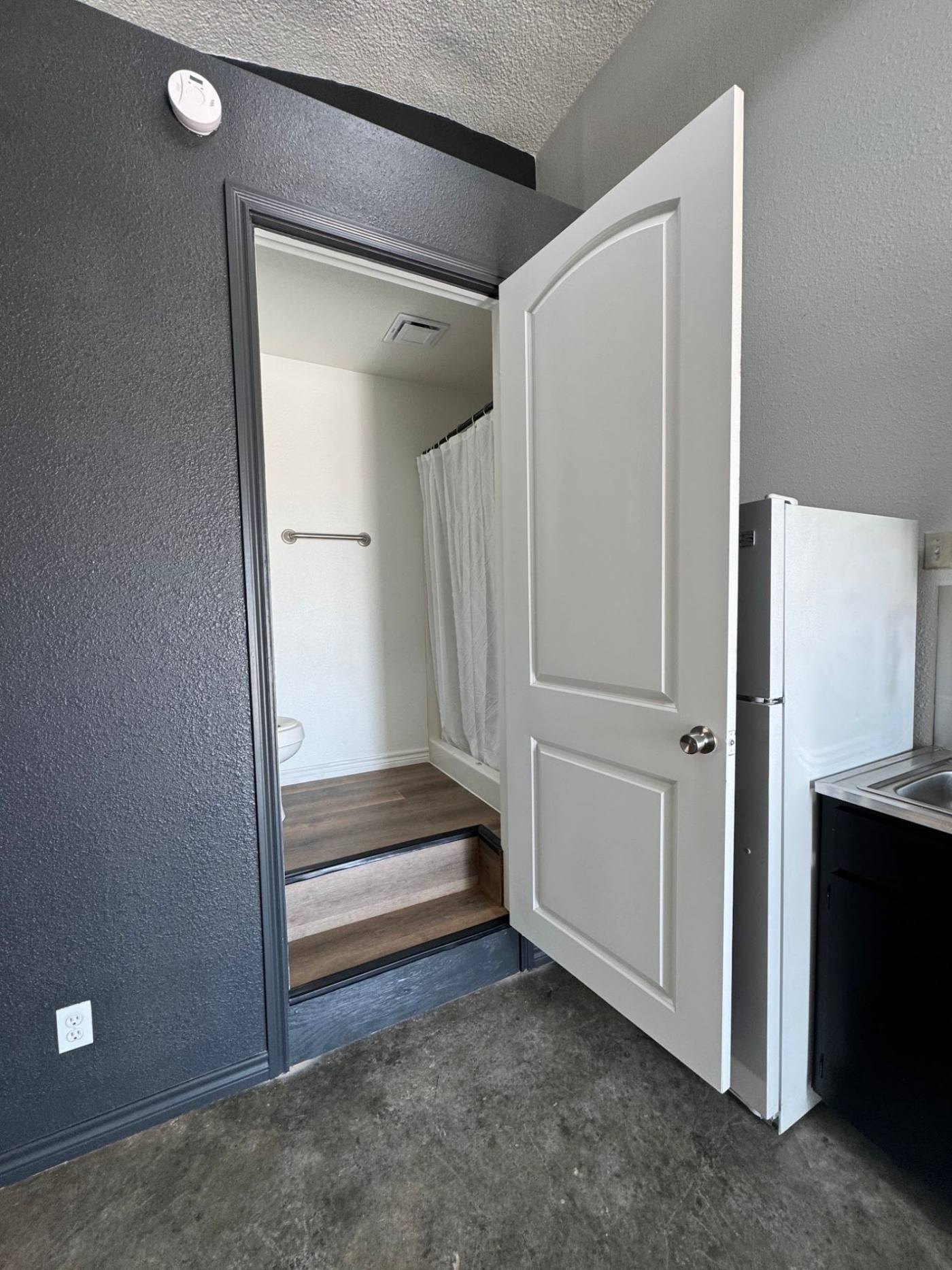 Bathroom entry beside the kitchenette in a dome unit at The Domain