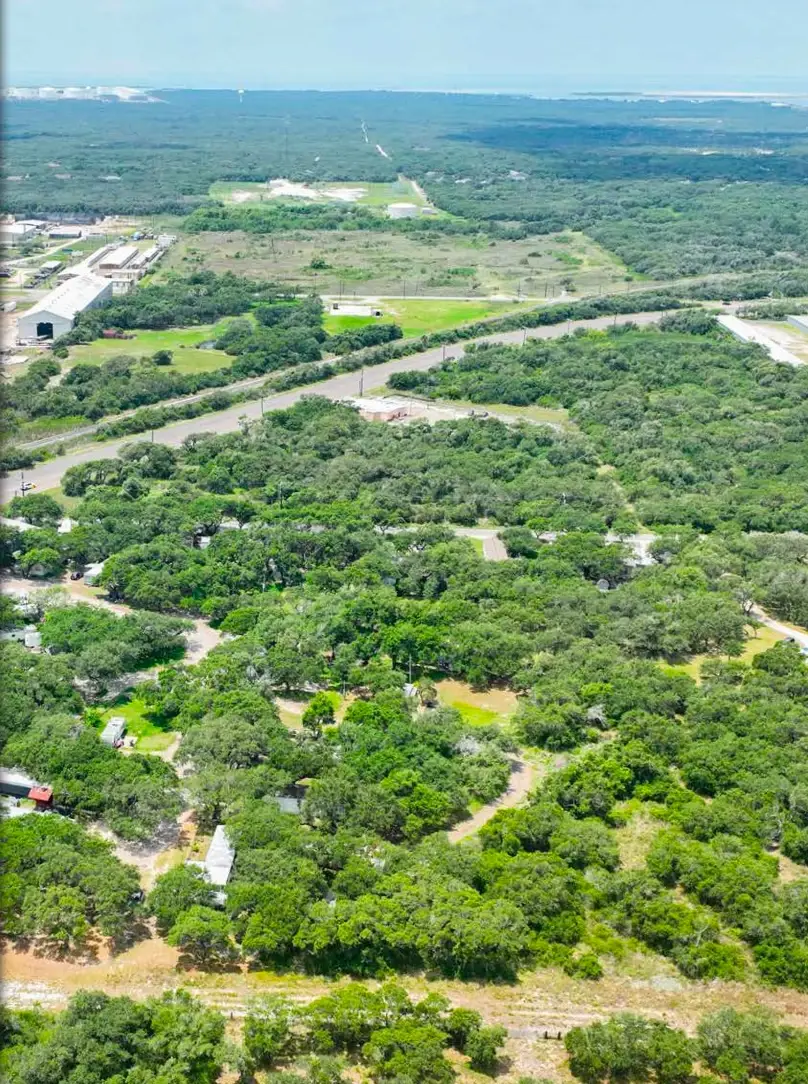 Wooded sites at Indian Trails RV Park seen from above, Ingleside, Texas