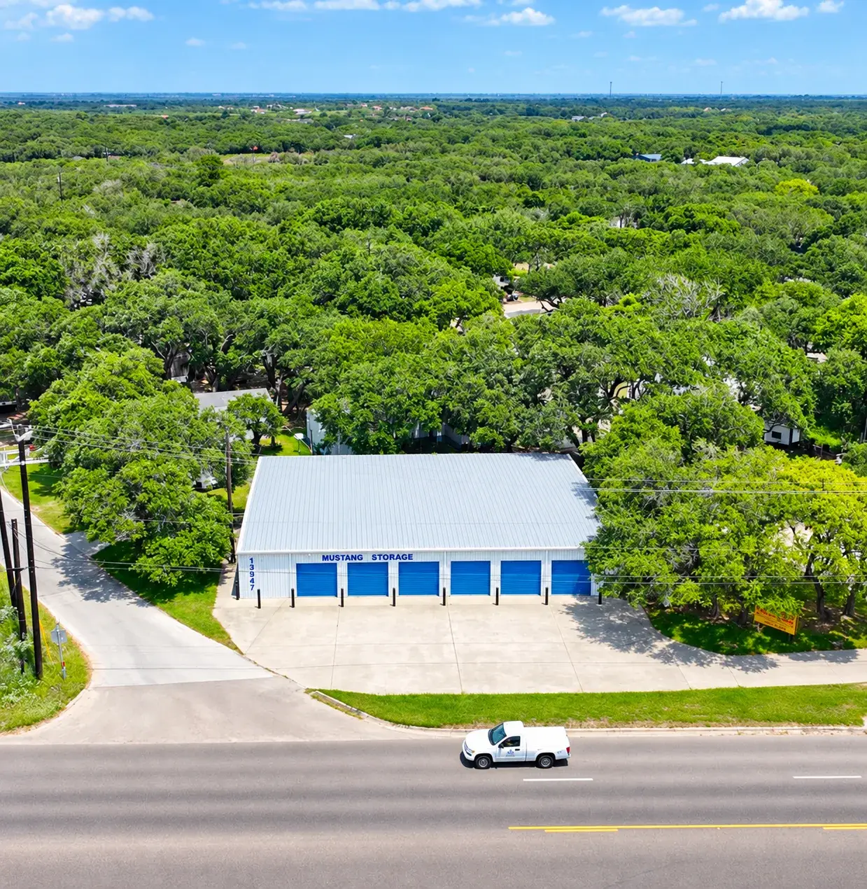 Mustang Storage building with blue roll-up doors in Ingleside, Texas